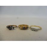 An 18ct gold ring set with sapphires (one stone missing), approx. 2.6g plus two 18ct gold and silver