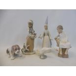 Five boxed Lladro figures.