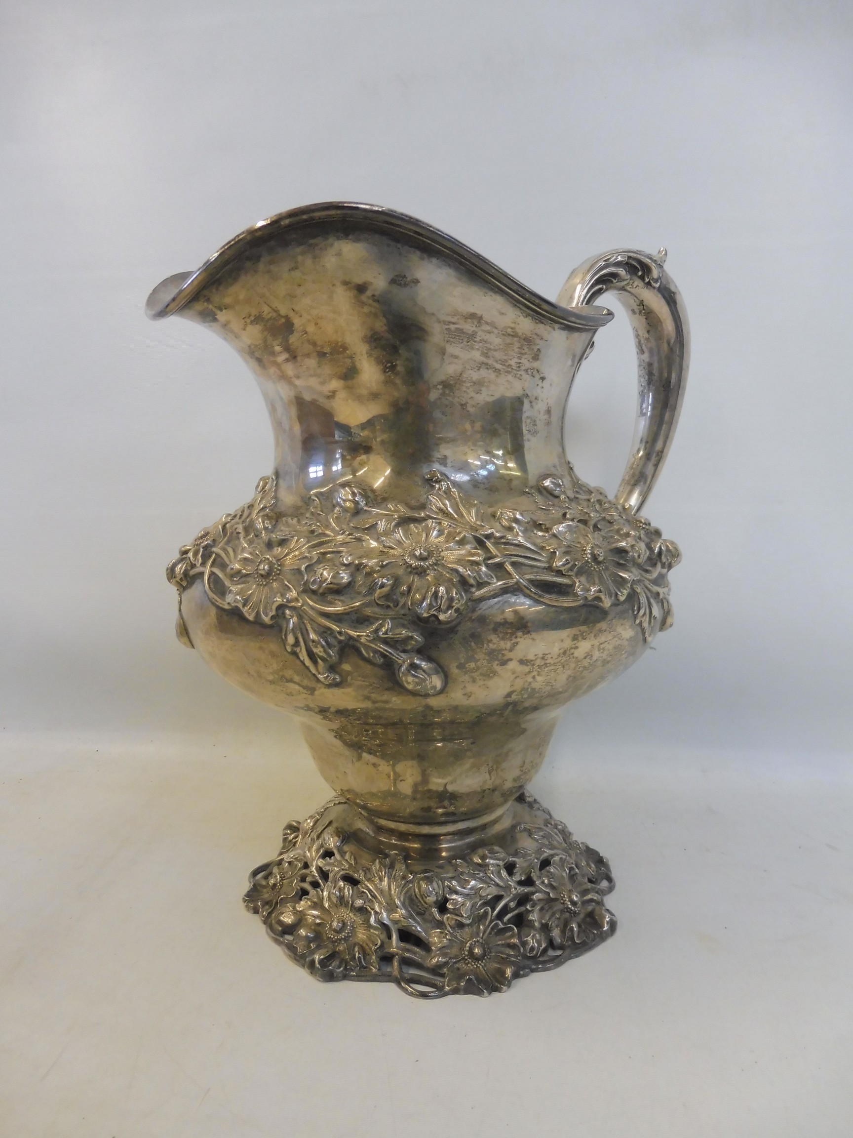 A large Sterling silver jug, with entwined floral design, raised on a pierced floral base, stamped - Image 2 of 4
