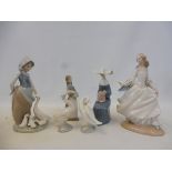 Five boxed Lladro figures.