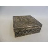 An Indian silver cigarette box with allover embossed decoration, weighs approx. 192.9g.