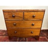 A 19th Century mahogany chest of two short and two long drawers, on swept bracket feet, 36" wide.