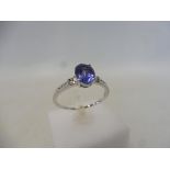 A tanzanite and diamond white gold ring, size S to T, approx. weight 2.2g.