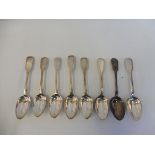 A collection of eight fiddle pattern dessert spoons, late Georgian and Victorian, various dates