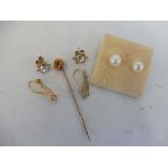 A 15ct gold tie pin, approx. 1.5g, two pairs of 9ct gold earrings both set with paste, approx. 2g