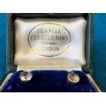 A cased pair of diamond stud earrings in a Hennell Frazer & Haws, London case.