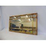 A rectangular gilt framed wall mirror with a marginal surround, 39" wide.