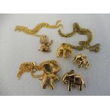 Four 9ct gold elephant charms, two on chains, approx. 6.3g overall plus a well detailed yellow metal