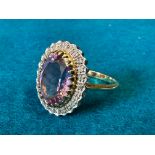 A 9ct gold amethyst and diamond ring, approx. 4.6g, hallmarked London and 'Dia .12', size R.