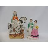A Staffordshire figure of Queen Mary on horseback, 10" high; and a model of a man and woman (
