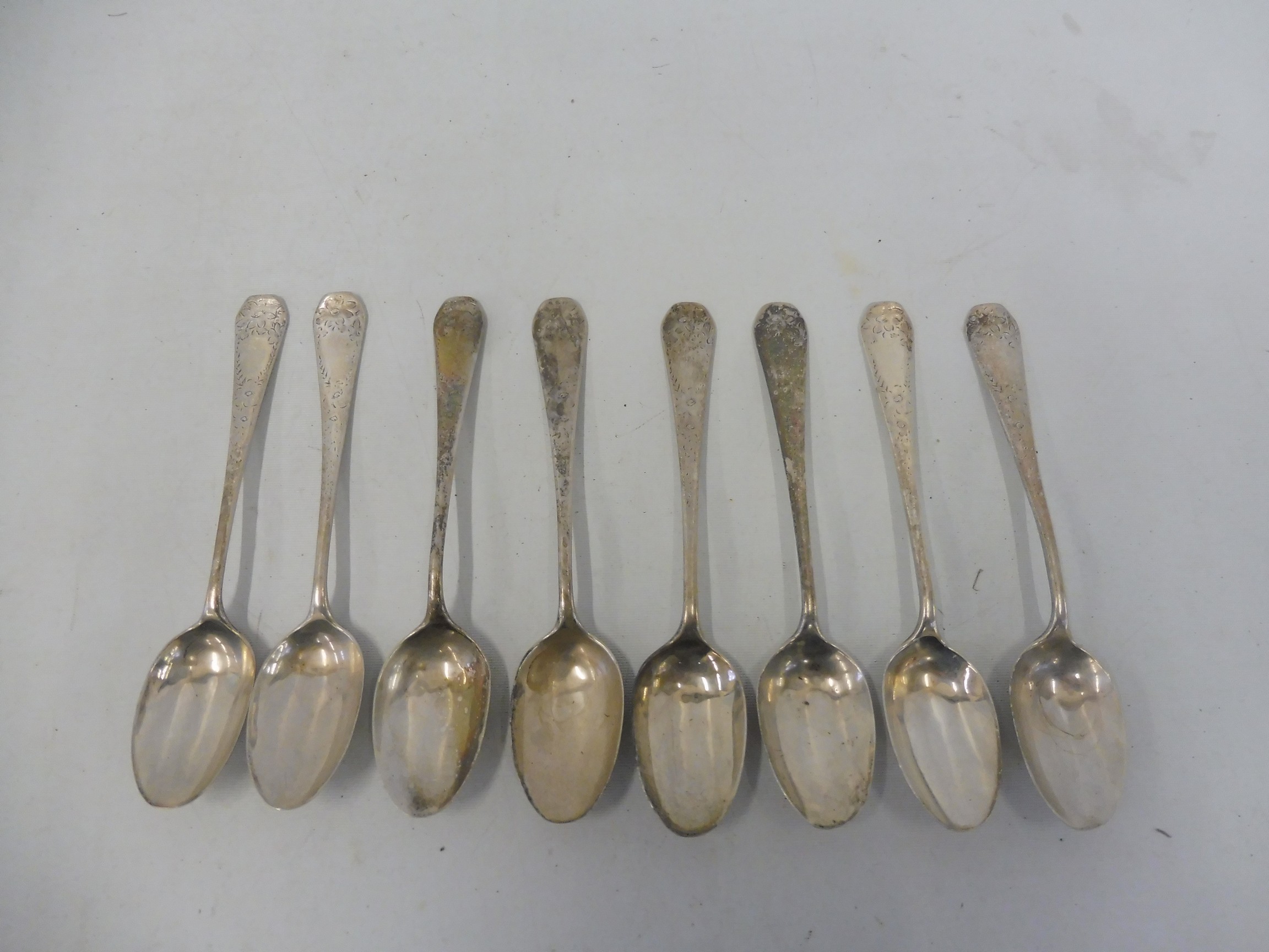 A set of eight teaspoons with bright cut decoration (rubbed).