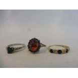 A gold sapphire and diamond ring, an emerald and diamond ring and a third set with amber, approx.