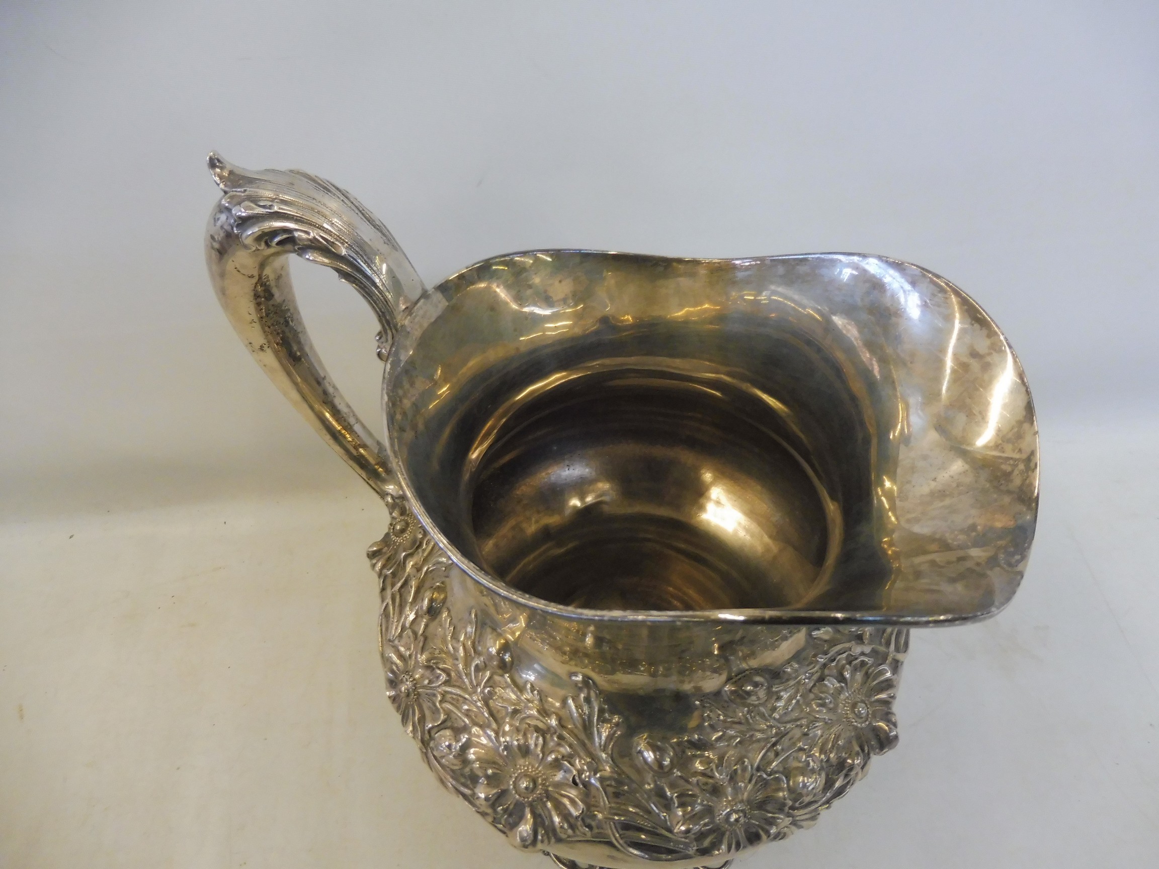 A large Sterling silver jug, with entwined floral design, raised on a pierced floral base, stamped - Image 3 of 4