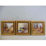 A pair of small gilt framed hand painted porcelain plaques, scenes of a pheasant in the countryside,