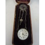 An early 20th Century cased ball clock on chain with hanging key and clip fitting, bearing