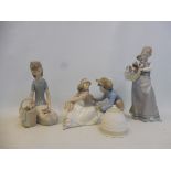 Four boxed Lladro figures.