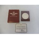 A cased 1976 Turks and Caicos Islands Twenty Crown proof coin, with certificate.