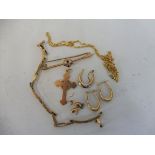 A selection of 9ct gold including a pendant cross, a bar brooch, two pairs of earrings etc.