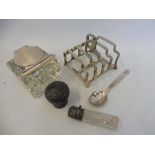 A silver five bar toast rack; a glass and silver mounted inkwell and silver items.
