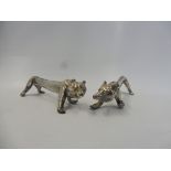 A novelty pair of silver plated knife rests in the form of elongated bears.