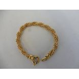 An 18ct gold bracelet, marked '750', approx. 17.5g.