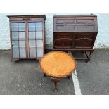 An oak bureau bookcase with geometric mouldings, the top has had feet added for use as a cabinet,