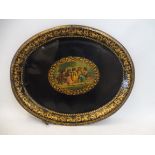 A 19th Century toleware tray decorated with a central scene of children playing, 12 3/4" w.