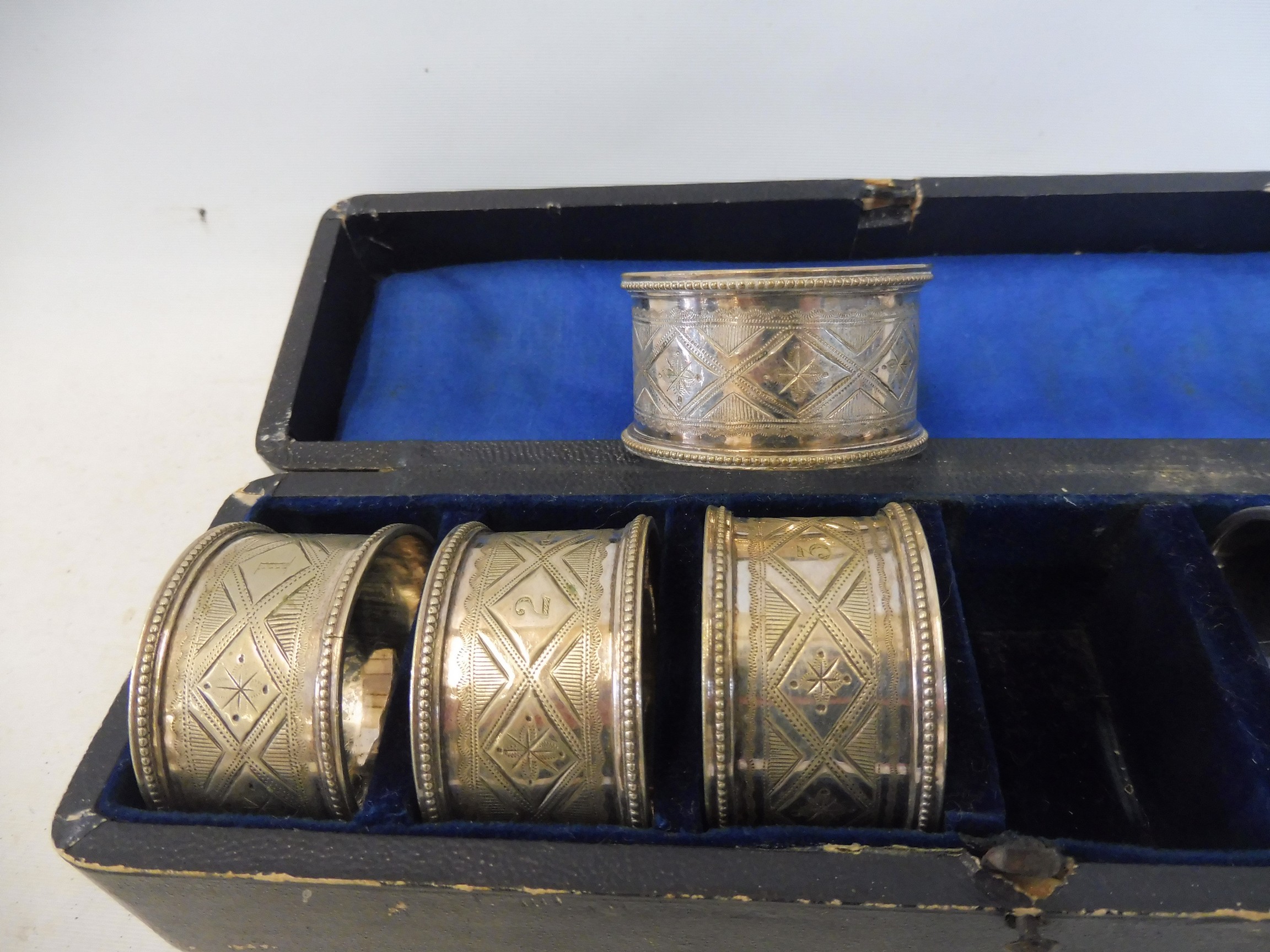 A cased set of six silver plated napkin rings 1-6. - Image 2 of 2