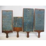 Four pine paddle boards with applied manufacturing instructions, three dated 1899, 1906 and 1907.