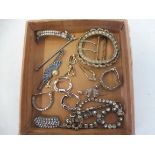A selection of paste jewellery including a buckle, two bracelets, brooches, earrings etc.