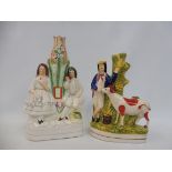 Two Staffordshire figural spill vases.
