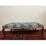 A Victorian walnut framed long stool with an upholstered seat on cabriole legs, 42 x 22".