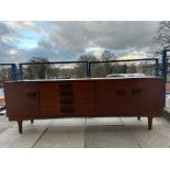 A Bath Cabinet Makers Ltd teak sideboard, 84 1/2" w x 29" h x 18 1/2" d.