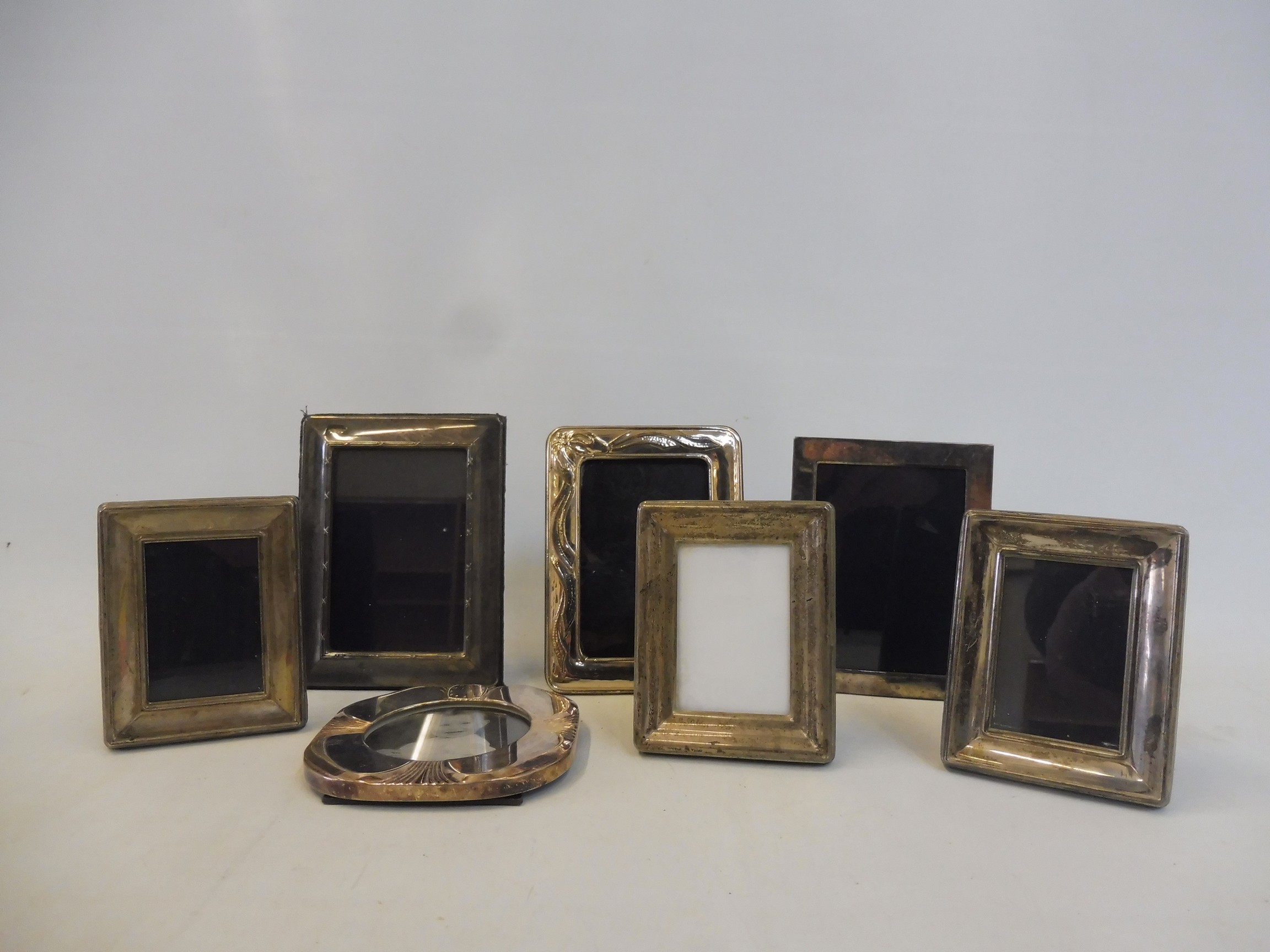 Six small contemporary photograph frames, five hallmarked silver.