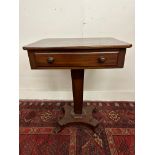 A Victorian mahogany side table with a rectangular top and drawer, on an octagonal column and
