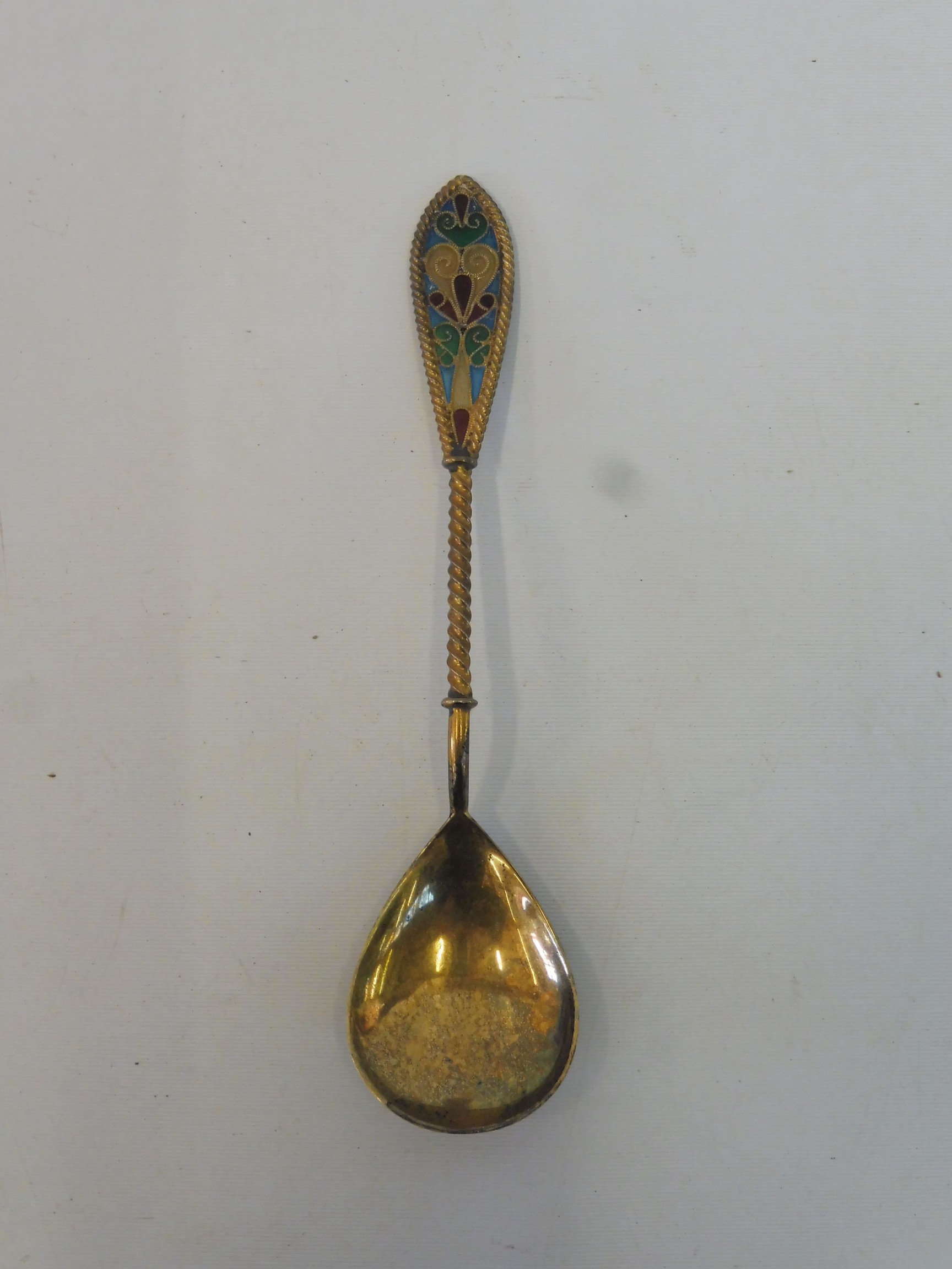 A Continental silver gilt spoon with an enamel handle, stamped .925 S.