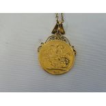A 1915 gold sovereign mounted as a pendant on a yellow metal chain, approx. 13.2g overall.