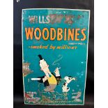 A Wills's Woodbines pictorial tin sign, 19 1/2 x 29 1/2".