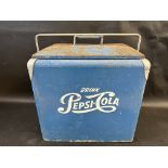 A circa 1950s Pepsi-Cola cooler box.