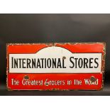 An International Stores grocers enamel sign, circa 1930s, 30 1/4 x 15".