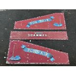 A selection of tin advertising signs removed from a Scammell lorry used at a fairground fun fair,