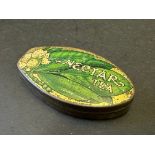 An unusual Nectar Tea leaf shaped tin.