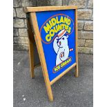 A Midland Counties Ice Cream A-board advertising sign with pictorial tin panels.