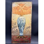 A very rare and early White Rose Lamp Oil embossed pictorial tin advertising sign depicting a blue