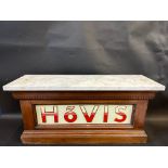 A walnut and marble topped counter with Hovis branded glass advertising panel, 27" w x 13" h x 9"