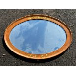 An oval mirror bearing advertising for Whitbread's Pale Ale, 33 x 24".