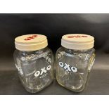 A pair of OXO Cubes glass jars with screw-on plastic lids.