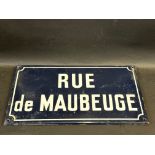 A small French road sign for Rue de Maubeuge, 17 3/4 x 10".