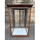 A Cadbury's Chocolate mahogany and glass counter top dispensing cabinet with sliding rear doors