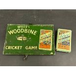 A Wills's Woodbine tin fronted 'Cricket Game' with advertising to the front, plus an associated